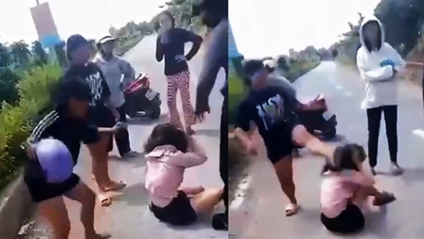Cháu N (áo hồng) bị nhóm người vây đánh rất dã man (ảnh cắt từ video)