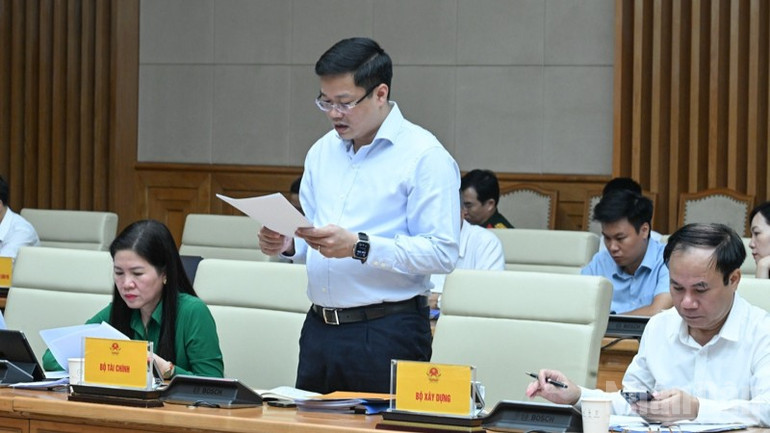 Đại diện lãnh đạo Bộ Tài chính báo cáo tại Hội nghị. (Ảnh: Trần Hải) ndo_br_a7-3934.jpg