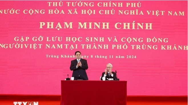 Thủ tướng Phạm Minh Chính tại cuộc gặp lưu học sinh và cộng đồng người Việt Nam tại thành phố Trùng Khánh, Trung Quốc. (Ảnh: Dương Giang/TTXVN)