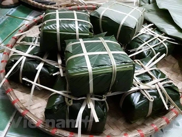 Bánh chưng là một thực phẩm quen thuộc ngày Tết. (Ảnh: PV/Vietnam+)