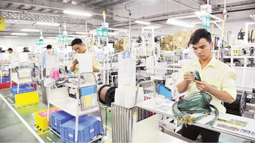 Cần có giải pháp quyết liệt hướng tín dụng chảy vào lĩnh vực sản xuất, kinh doanh. Ảnh | Trần Hải