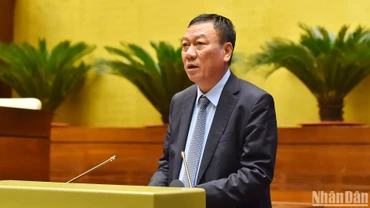 Tổng Thanh tra Chính phủ Đoàn Hồng Phong trình bày Báo cáo về công tác phòng, chống tham nhũng năm 2024. (Ảnh: THỦY NGUYÊN)
