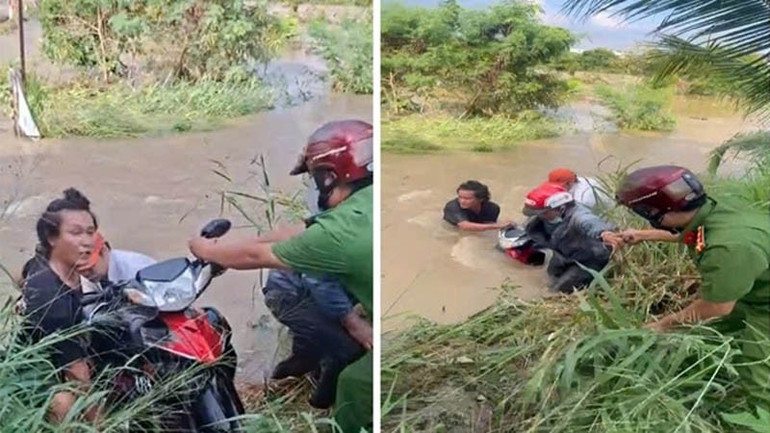 Công an xã Tuyên Quang hỗ trợ người dân đưa xe máy ra khỏi khu vực bị ngập. 3-cong-an-xa-tuyen-quang-ho-tro-nguoi-dan-dua-xe-may-ra-khoi-khu-vuc-ngap-nuoc.jpg