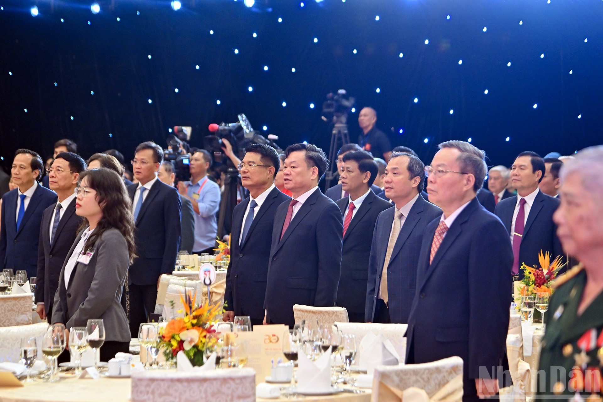 Delegates perform the flag salute ceremony at the reception. ndo_br_9-104.jpg