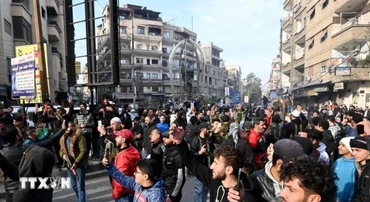 Người dân tại thủ đô Damascus, Syria ngày 8/12/2024. (Ảnh: THX/TTXVN)