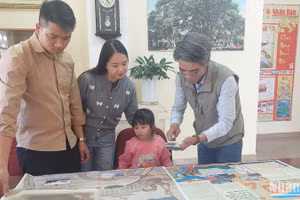 Bạn đọc trên vùng đất Nam Tây Nguyên hào hứng với phụ san đặc biệt của Báo Nhân Dân .