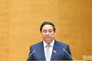 Thủ tướng Phạm Minh Chính trình bày Báo cáo của Chính phủ tại phiên khai mạc Kỳ họp. (Ảnh: DUY LINH)