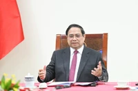 Thủ tướng Chính phủ Phạm Minh Chính điện đàm với Thủ tướng Singapore Lawrence Wong. (Ảnh: TRẦN HẢI)