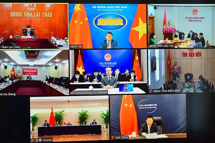 Hội thảo trao đổi trực tuyến Việt Nam-Trung Quốc về kinh nghiệm xóa đói giảm nghèo. Ảnh: BNG