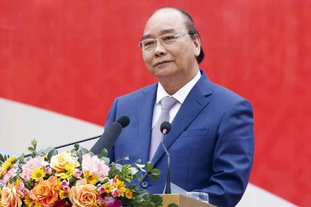 Chủ tịch nước Nguyễn Xuân Phúc phát biểu tại Lễ phát động thi đua năm 2022 của Tập đoàn Dệt may Việt Nam. (Ảnh: VOV)