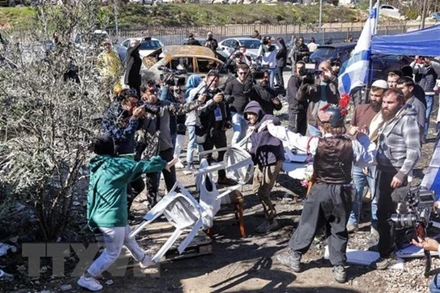 Xung đột giữa người Palestine và người định cư Israel ở khu vực Sheikh Jarrah thuộc Đông Jerusalem, ngày 13/2/2022. (Ảnh: AFP/TTXVN)