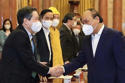 Chủ tịch nước Nguyễn Xuân Phúc với các đại biểu dự hôi nghị. (Ảnh: Thống Nhất/TTXVN)