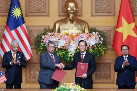 Lễ Trao đổi “Bản ghi nhớ về tuyển dụng, việc làm và hồi hương lao động giữa Chính phủ nước CHXNCN Việt Nam và Chính phủ Malaysia”.