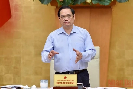 Thủ tướng Phạm Minh Chính chủ trì Hội nghị trực tuyến của Thường trực Chính phủ sơ kết 1 tháng công tác phòng, chống dịch Covid-19. (Ảnh: TRẦN HẢI)