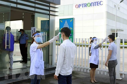 Phát huy hiệu quả Tổ An toàn Covid-19 tại các doanh nghiệp, đơn vị trên địa bàn thành phố Hà Nội. (Ảnh: TTXVN)