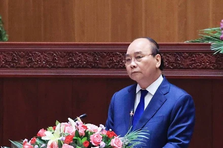 Chủ tịch nước Nguyễn Xuân Phúc phát biểu tại Kỳ họp lần thứ nhất, Quốc hội Lào khóa IX. (Ảnh: TTXVN)