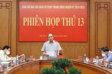 Chủ tịch nước Nguyễn Xuân Phúc, Trưởng Ban Chỉ đạo Cải cách Tư pháp Trung ương phát biểu tại phiên họp. (Ảnh: TTXVN)