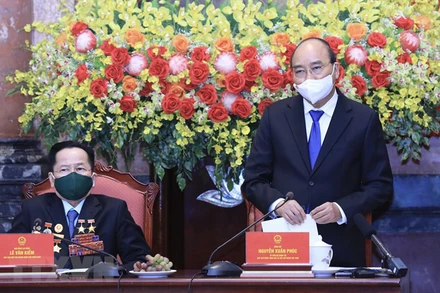 Chủ tịch nước Nguyễn Xuân Phúc phát biểu tại buổi gặp. (Ảnh: Lâm Khánh/TTXVN)