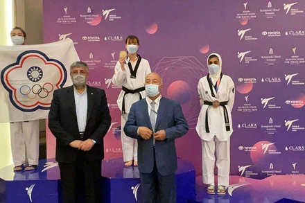 Kim Tuyền nhận đồng HCV taekwondo (Ảnh: Đội tuyển Việt Nam cung cấp).