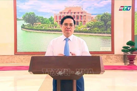 Thủ tướng Chính phủ Phạm Minh Chính phát biểu tại chương trình trực tuyến. (Ảnh chụp qua màn hình: Thu Hương/TTXVN)