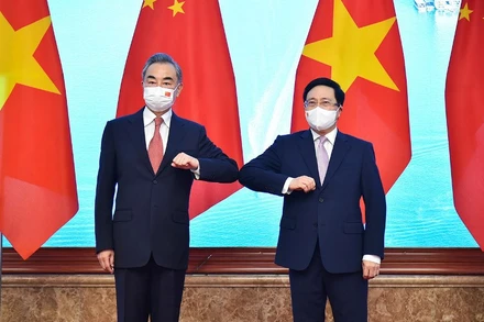 Phó Thủ tướng Thường trực Phạm Bình Minh và Ủy viên Quốc vụ, Bộ trưởng Ngoại giao Trung Quốc Vương Nghị dự Phiên họp lần thứ 13 Ủy ban chỉ đạo hợp tác song phương Việt Nam - Trung Quốc. (Ảnh: Thế giới và Việt Nam)