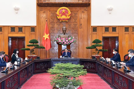 Thủ tướng Chính phủ Phạm Minh Chính tiếp Đại sứ Romania. (Ảnh: NHẬT BẮC)