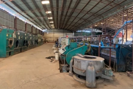 Một phân xưởng máy giặt công nghiệp bị phá sản tại Lào do ảnh hưởng tiêu cực của dịch bệnh Covid-19. 