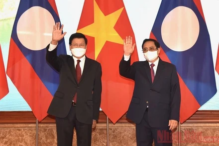 Thủ tướng Chính phủ Phạm Minh Chính và Tổng Bí thư, Chủ tịch nước Cộng hòa dân chủ nhân dân Lào Thongloun Sisoulith. (Ảnh: Trần Hải)