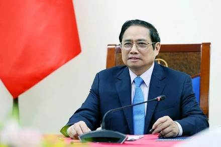 Thủ tướng Phạm Minh Chính điện đàm với Thủ tướng Italia Mario Draghi. (Ảnh: TTXVN)