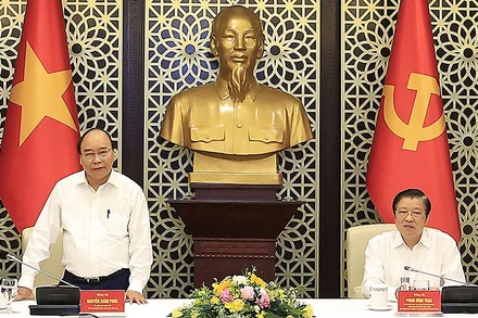 Chủ tịch nước Nguyễn Xuân Phúc phát biểu ý kiến tại buổi làm việc. (Ảnh TTXVN)