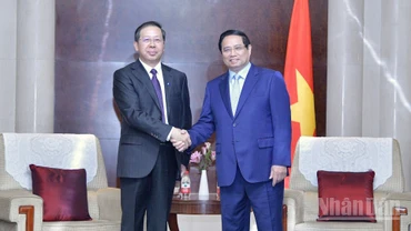 Thủ tướng Phạm Minh Chính và Chủ tịch Hội đồng quản trị Tập đoàn Khoa học công nghệ Hoa Điện Trung Quốc (CHEC) Bành Cương Bình. (Ảnh: THANH GIANG)
