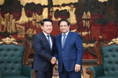 Thủ tướng Phạm Minh Chính đón Phó Thủ tướng Chính phủ, Trưởng Ban Cải cách doanh nghiệp Lào Saleumxay Kommasit.