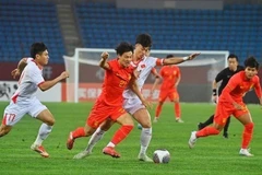 U22 Việt Nam (áo trắng) thi đấu kiên cường, thắng đội chủ nhà U22 Trung Quốc 1-0.