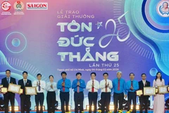 Vinh danh các kỹ sư, công nhân đạt Giải thưởng Tôn Đức Thắng lần thứ 25. (Ảnh: HOÀNG HÙNG)