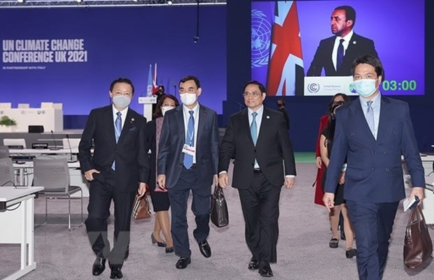Thủ tướng Phạm Minh Chính và các thành viên Đoàn đại biểu Việt Nam tại Hội nghị của Liên hợp quốc về biến đổi khí hậu (COP26). (Ảnh: TTXVN) Chung tay cùng thế giới ứng phó với biến đổi khí hậu -0