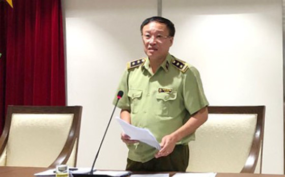 Phó Cục trưởng Cục QLTT Hà Nội Nguyễn Minh Hùng thông tin tại hội nghị giao ban báo chí chiều 8-9.