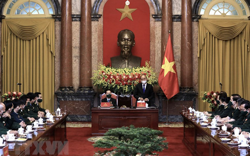 Chủ tịch nước Nguyễn Xuân Phúc ghi nhận những nỗ lực của các doanh nghiệp, doanh nhân cựu chiến binh trong sản xuất kinh doanh, đóng góp vào các hoạt động xã hội. (Ảnh: Lâm Khánh/TTXVN) Doanh nhân cựu chiến binh gương mẫu, tự lực, tự cường, tích cực đóng góp phát triển đất nước -0