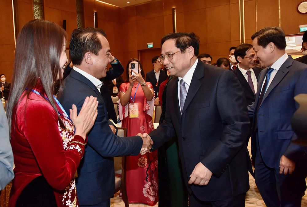 Thủ tướng Phạm Minh Chính và các đại biểu tham dự sự kiện. (Ảnh: Trần Hải) Thế hệ này tiếp nối thế hệ khác cùng hướng về quê hương, Tổ quốc và đồng bào -0