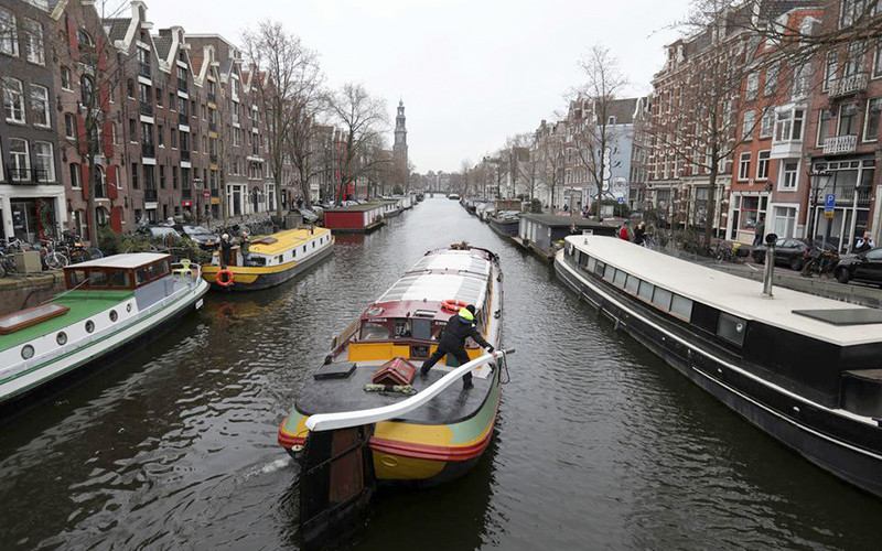 Được biết đến với những con đường dành cho xe đạp và kênh đào, Amsterdam được ca ngợi về tính bền vững và không gian xanh. Ảnh: Reuters 10 thành phố “tuyệt vời nhất thế giới” năm 2021 -0