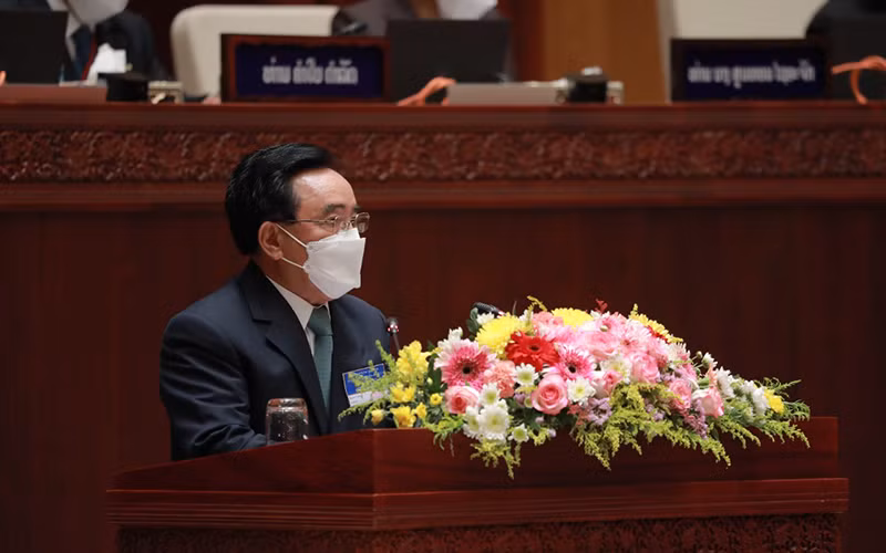 Thủ tướng Lào Phankham Viphavanh nhấn mạnh ba biện pháp trọng tâm nhằm mục tiêu mở cửa quốc gia. (Ảnh: Xuân Sơn)