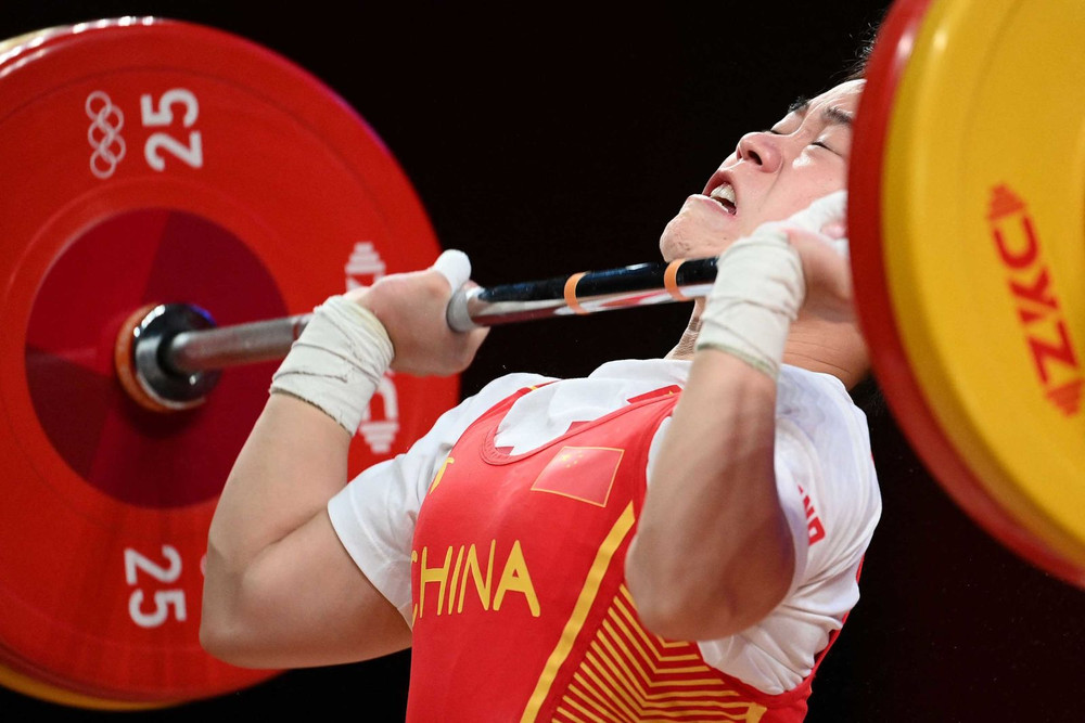Một trong những kỷ lục Olympic mới đầu tiên được thiết lập ngay trong ngày thi đấu 24/7. Nữ đô cử Trung Quốc, Hou Zhihui lập kỷ lục Olympic ở hạng cân 49kg, nâng 94 kg ở nội dung cử giật và 116kg cử đẩy. (Ảnh: Getty Images) Những khoảnh khắc đáng nhớ tại Olympic Tokyo 2020 -0