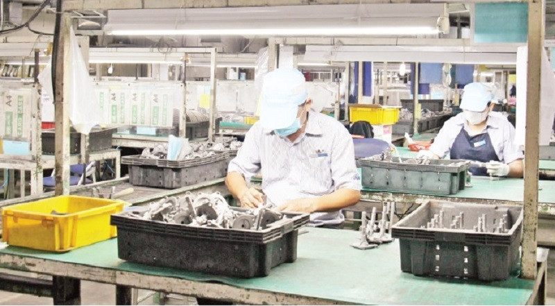 Doanh nghiệp sản xuất, kinh doanh hàng hóa xuất khẩu có nhu cầu vay vốn lớn. (Ảnh: THẾ ANH)