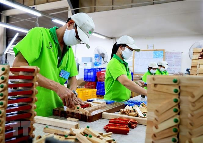 Lao động Thành phố Hồ Chí Minh quay lại làm việc sau Tết. (Ảnh: TTXVN)