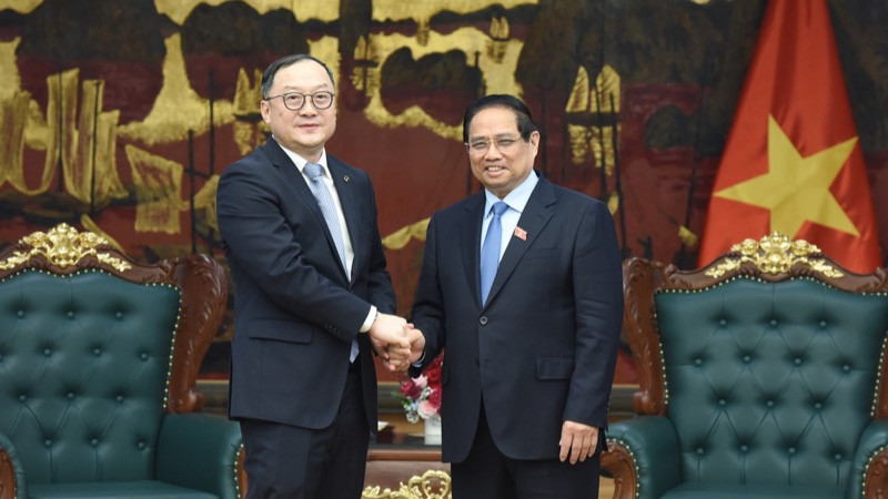 Thủ tướng Chính phủ Phạm Minh Chính và ông Châu Gia Nghĩa, Chủ tịch phụ trách khu vực châu Á-Thái Bình Dương của Tập đoàn Xây dựng Điện lực Trung Quốc (PowerChina). (Ảnh: TRẦN HẢI)