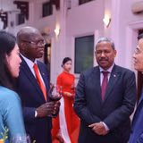 Đồng chí Đoàn Minh Huấn, Ủy viên Bộ Chính trị, Giám đốc Học viện Chính trị quốc gia Hồ Chí Minh tại buổi gặp mặt. 