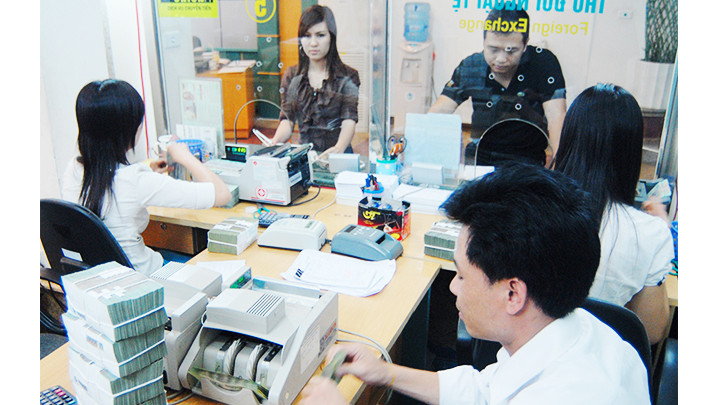 Nhiều doanh nghiệp đang gặp khó khăn về vốn. Ảnh: NGUYỆT ANH