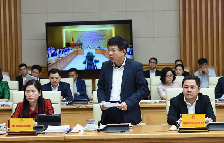 Đại diện lãnh đạo Ban quản lý vốn Nhà nước trình bày báo cáo tại hội nghị. (Ảnh: TRẦN HẢI)