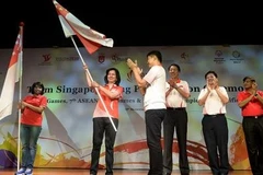 Tại lễ trao quốc kỳ cho các VĐV nữ Singapore.