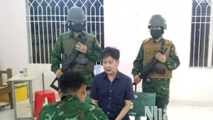 Phạm Mạnh Tân bị lực lượng chức năng bắt giữ.