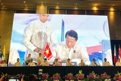 Đại tướng Lương Tam Quang, Ủy viên Bộ Chính trị, Bộ trưởng Công an Việt Nam tại lễ ký kết. 